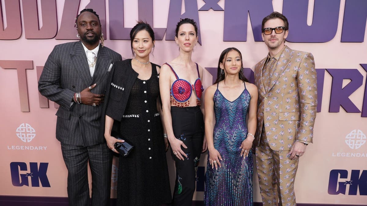 Brian Tyree Henry, Fala Chen, Rebecca Hall, Kaylee Hottle and Dan Stevens stand at a premiere in Hollywood, California.