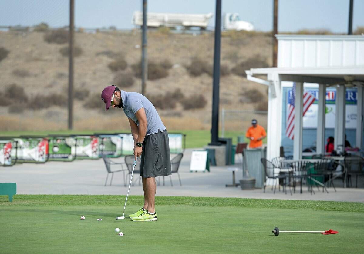 Amrit Nat of Fresno practices putting on a practice green on the golf course back when it was known as River Park Golf Center. The facility along Highway 41 in Madera County has operated under the name Valley Golf Center since 2018. The nine-hole golf course is set to close by July 29, with the operators set to retire.