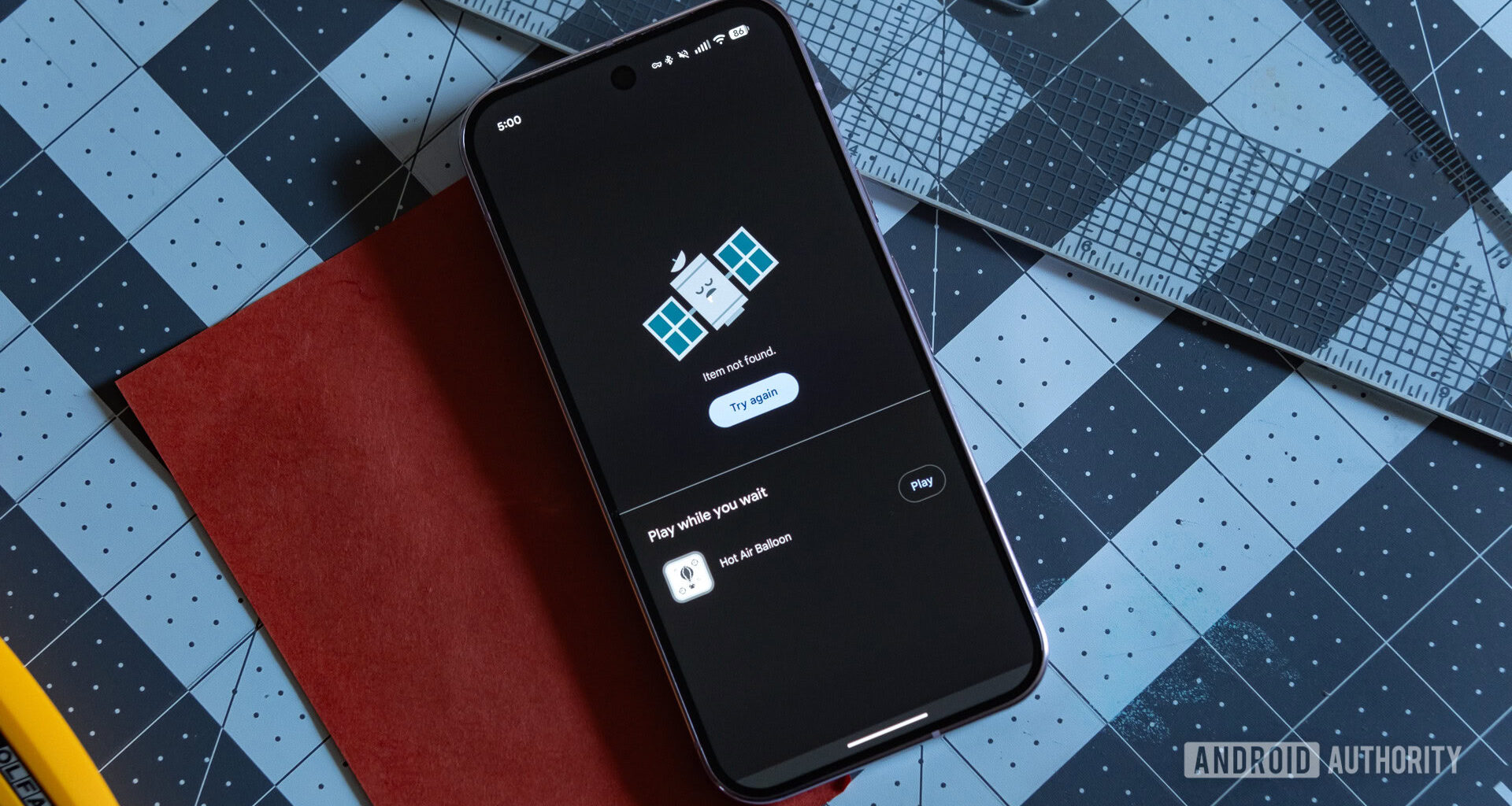 A Google Pixel 9 Pro showing a Play Store screen that reads 'Item not found.'