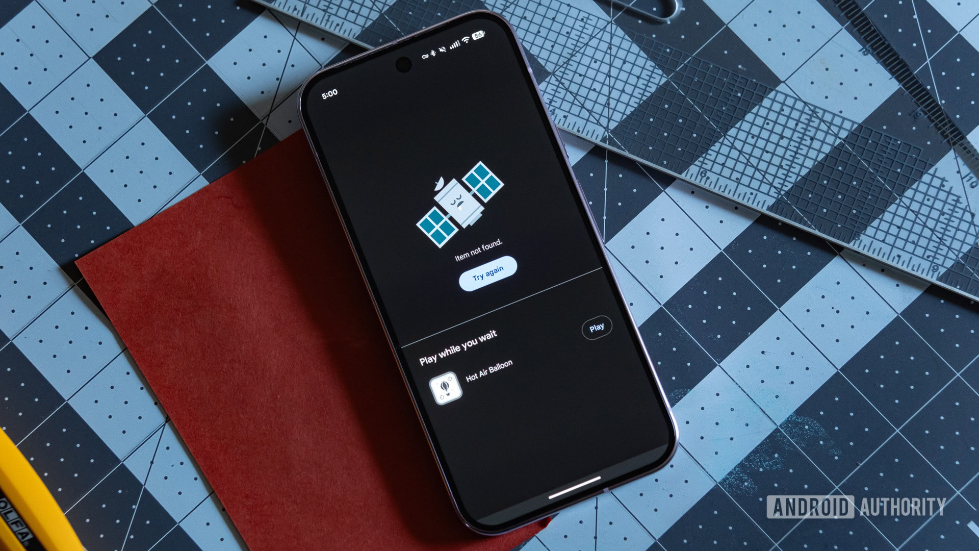 A Google Pixel 9 Pro showing a Play Store screen that reads 'Item not found.'