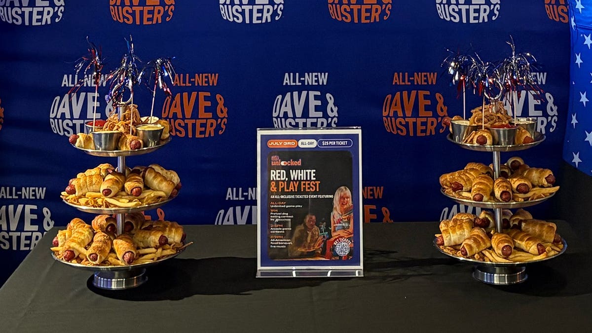 two pretzel dog towers at Dave & Buster's on a table