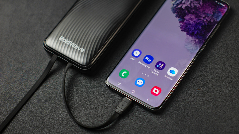 A Samsung phone charging while connected to a power bank