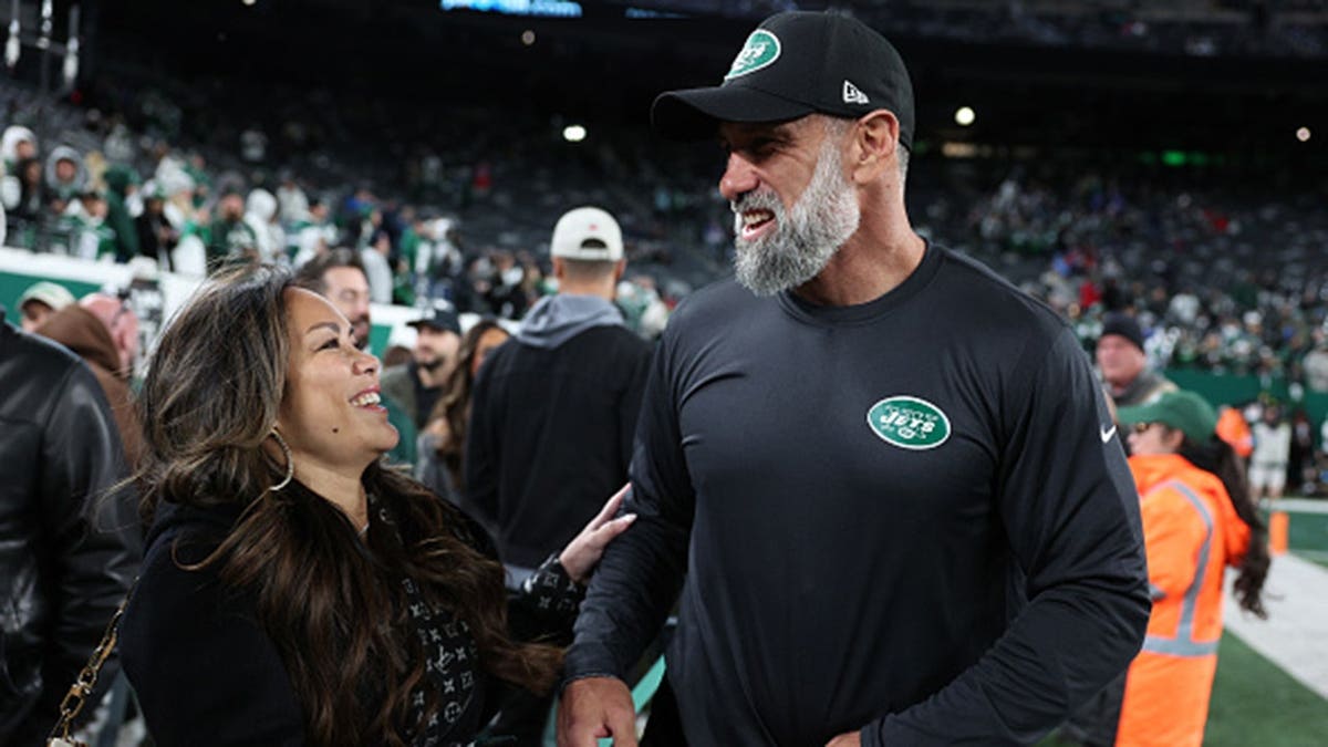 Jeff Ulbrich and his wife Cristina embrace before a game at MetLife Stadium.