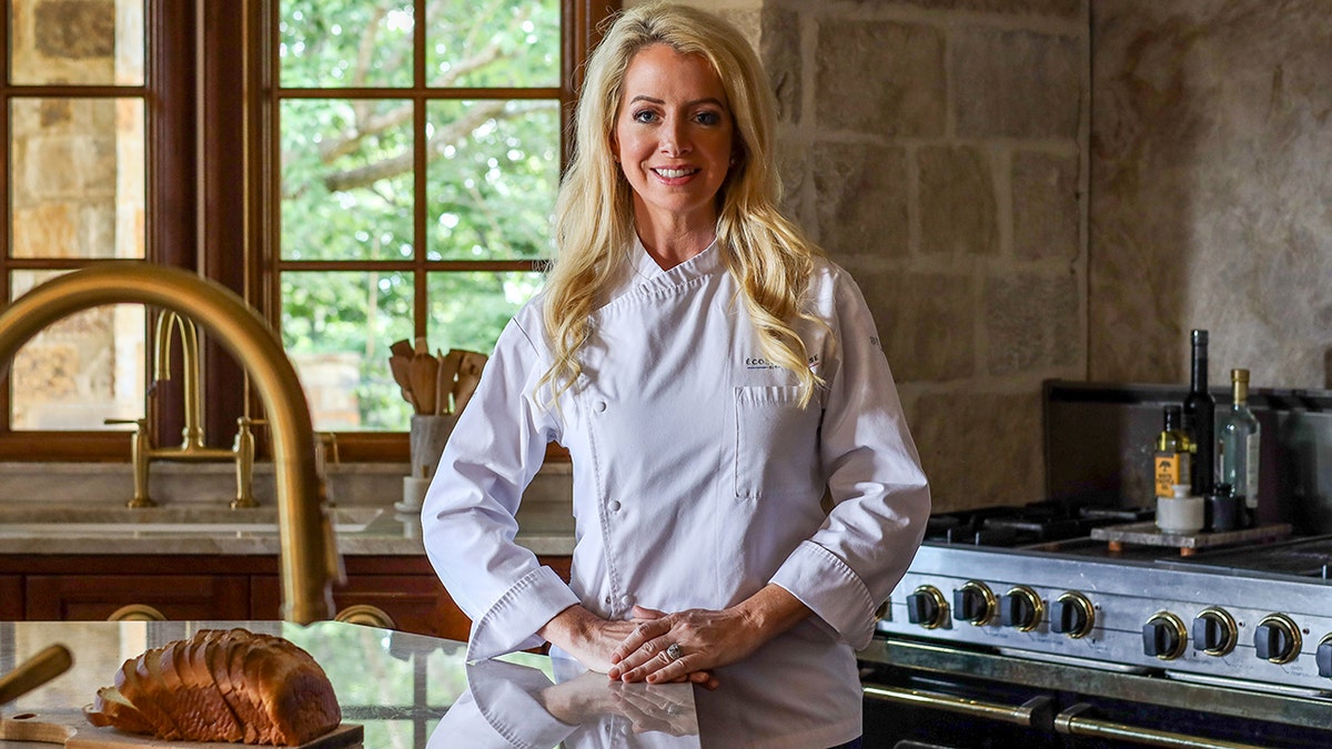 Jennifer Maune poses for a photograph in a home kitchen.