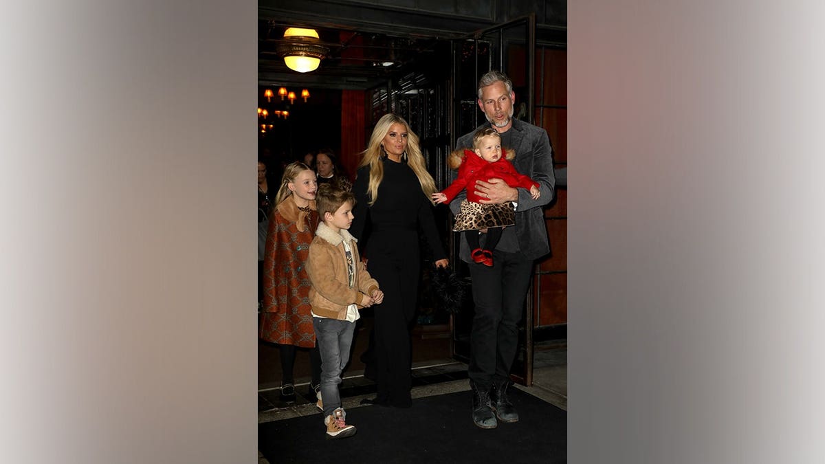 Jessica Simpson, Eric Johnson and their children leave a hotel in New York City.