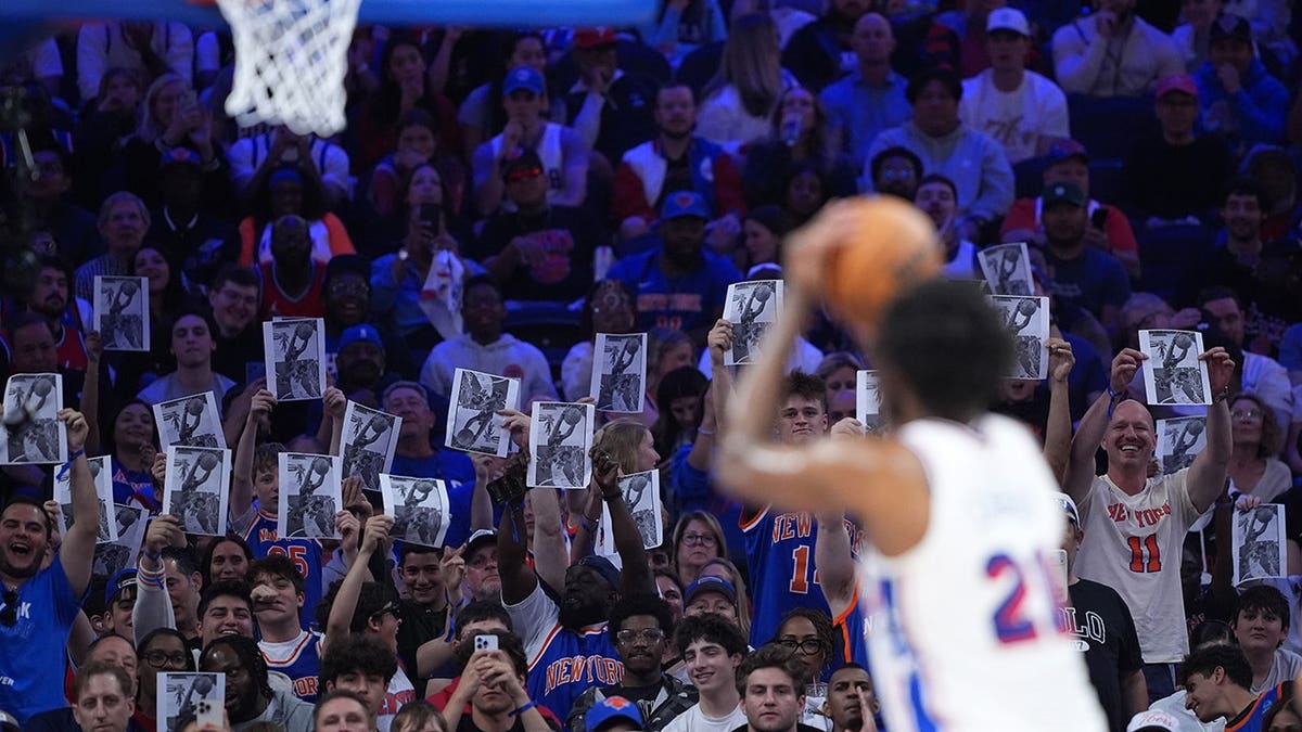 Joel Embiid shooting a free throw during an NBA playoff game in Philadelphia