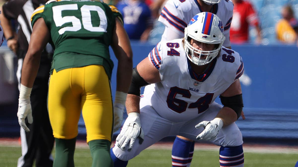 Jordan Devey #64 of the Buffalo Bills looks to make a block during a game.