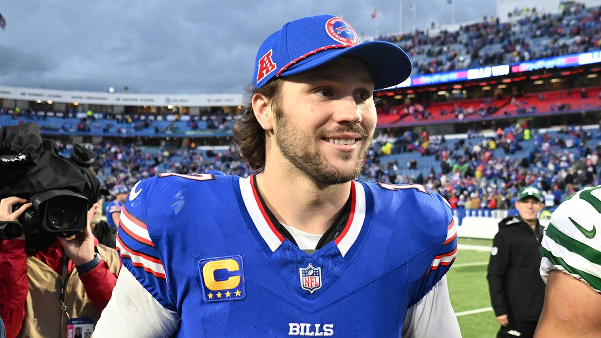 Josh Allen walks off the football field