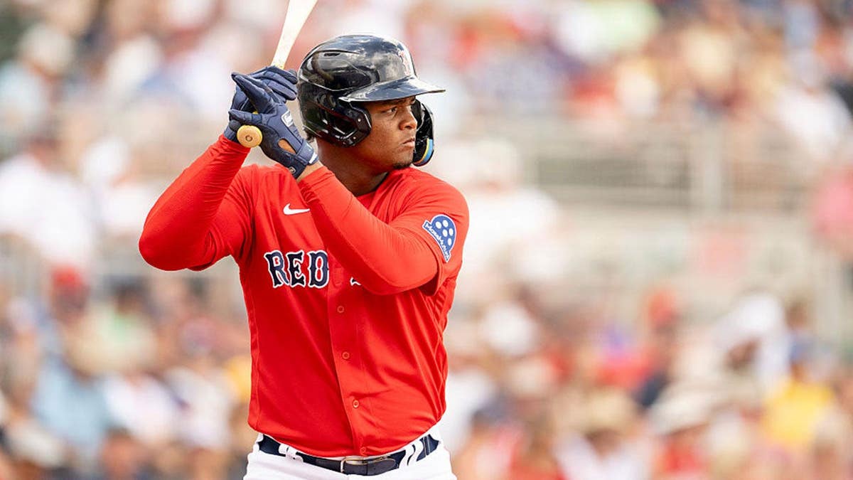 Justin Gonzales of the Boston Red Sox bats during a spring training game.