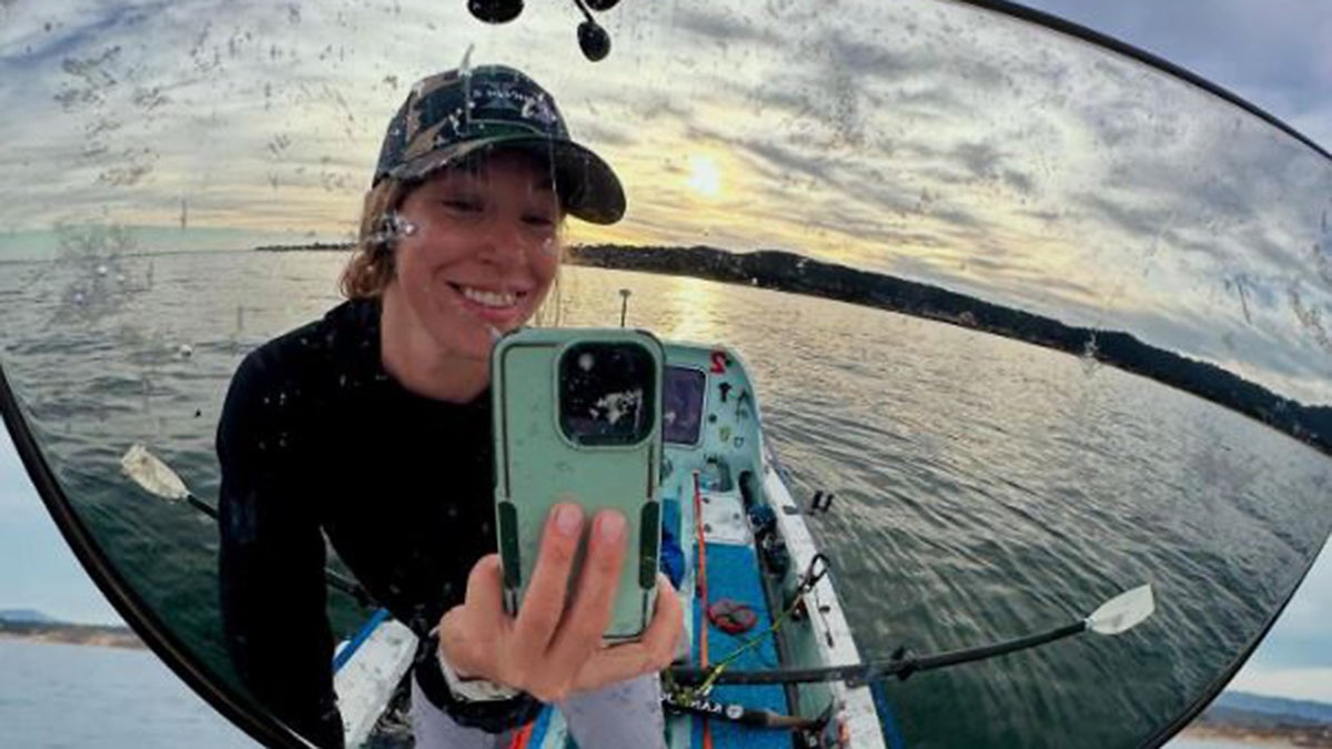 Kelsey Pfendler arrived at Honolulu Harbor aboard her 21-foot boat, Lily.
