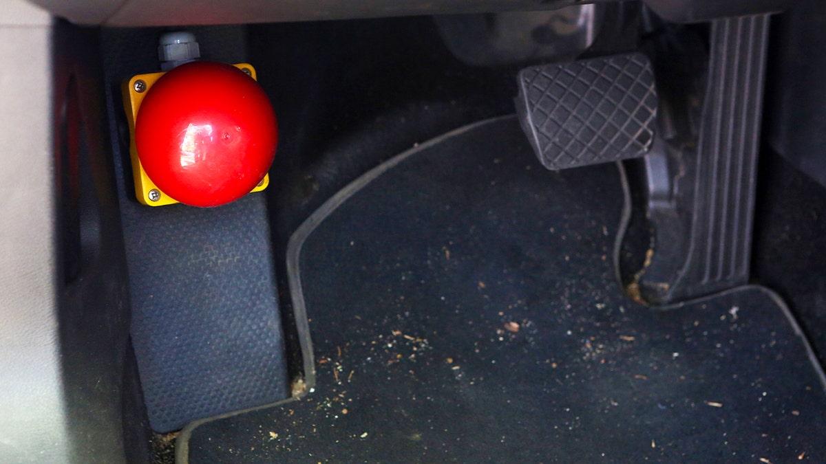 An emergency kill switch is seen on the floor of a vehicle at the Dahlem Center for Machine Learning and Robotics (DCMLR) at the Freie Universität (Free University) on June 04, 2019 in Berlin, Germany.