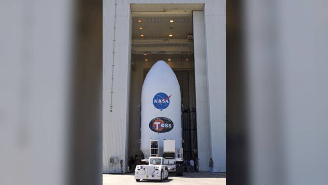 The payload fairing for NASA's Transiting Exoplanet Survey Satellite (TESS) is moved inside the Payload Hazardous Servicing Facility at the agency's Kennedy Space Center in Florida. Inside the facility