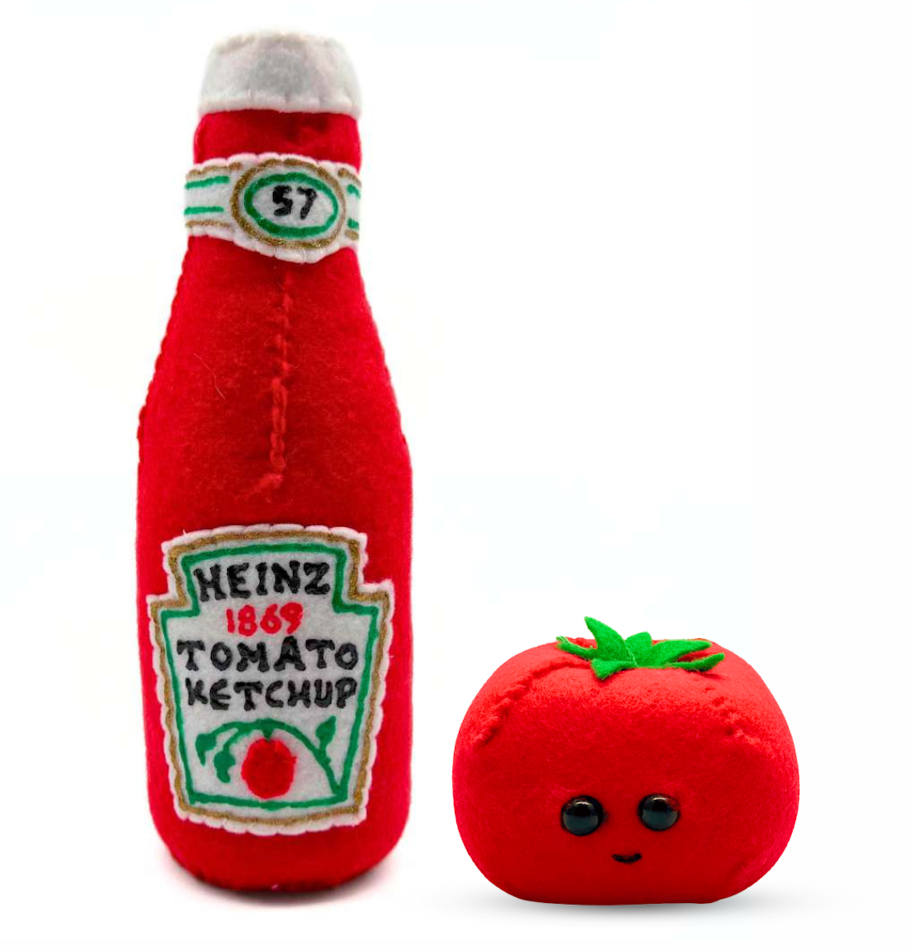 Heinz tomato ketchup and a tomato with a face reimagined in felt by artist Lucy Sparrow