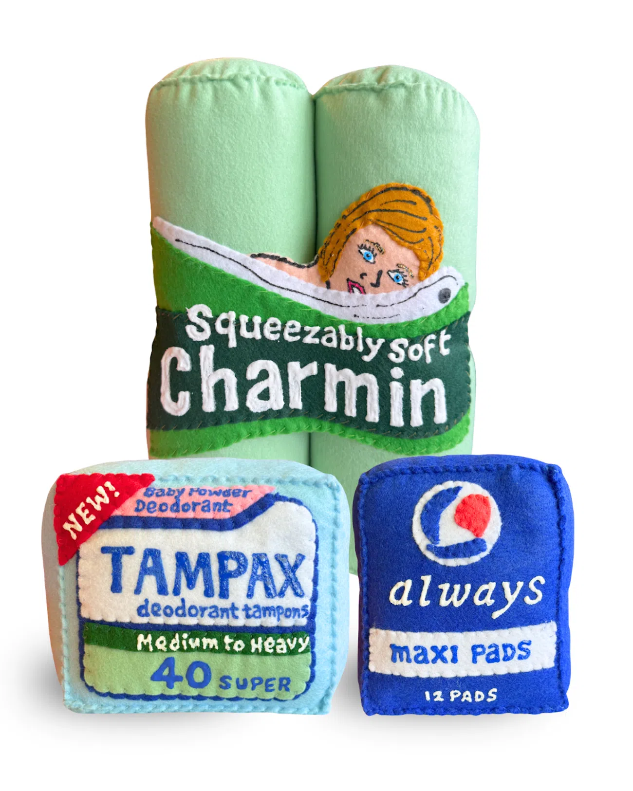 Charmin paper towels, Tampax tampons, and Always maxi pads packages reimagined in felt by artist Lucy Sparrow
