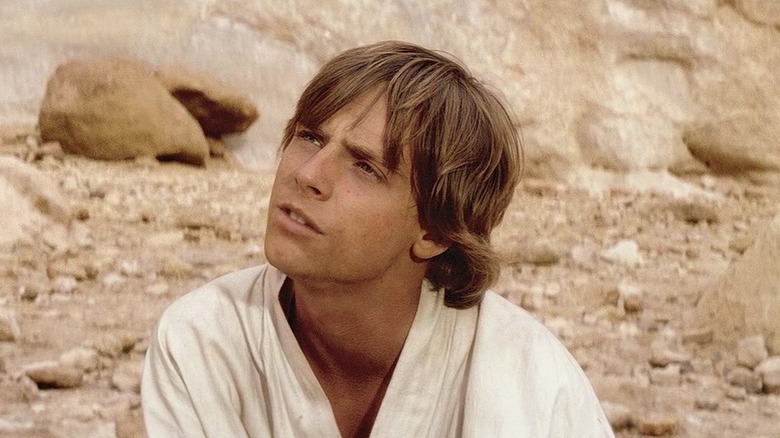 Mark Hamill as Luke Skywalker, looking up in confusion, in Star Wars: A New Hope.