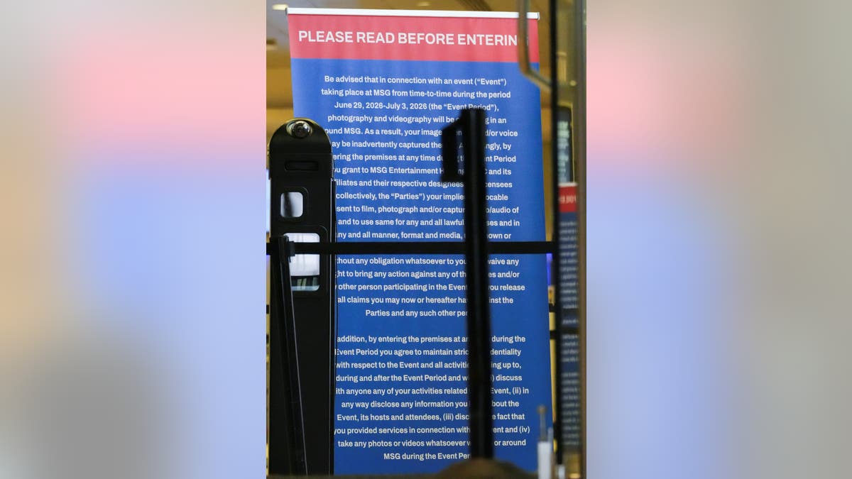 An information sign is displayed at one of the entries to Madison Square Garden as seen from outside