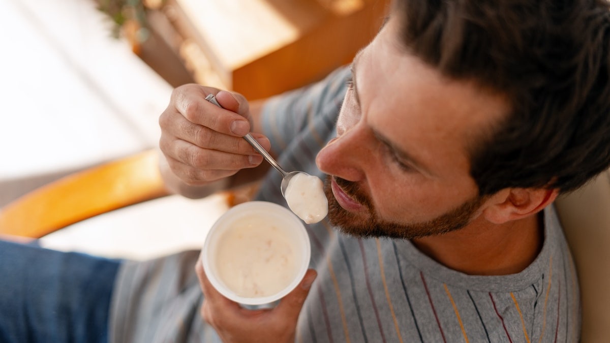 Man eating yogurt
