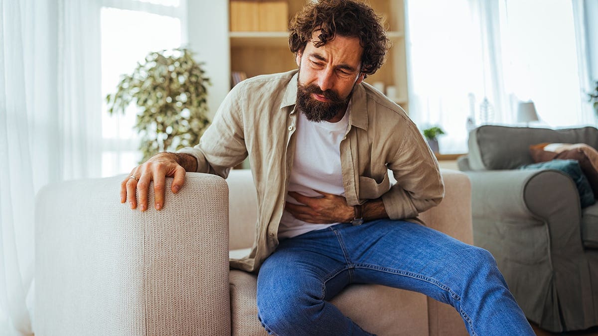 Man holding his stomach