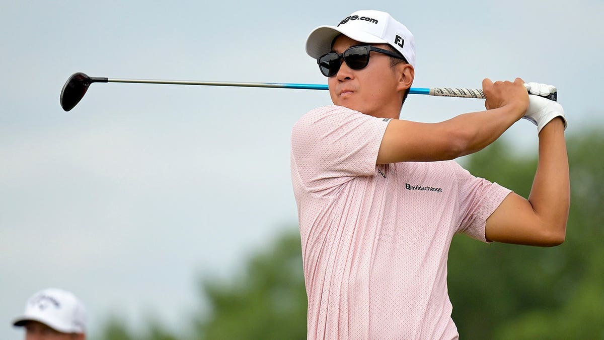 Michael Kim hits a tee shot during the 3M Open golf tournament at TPC Twin Cities.