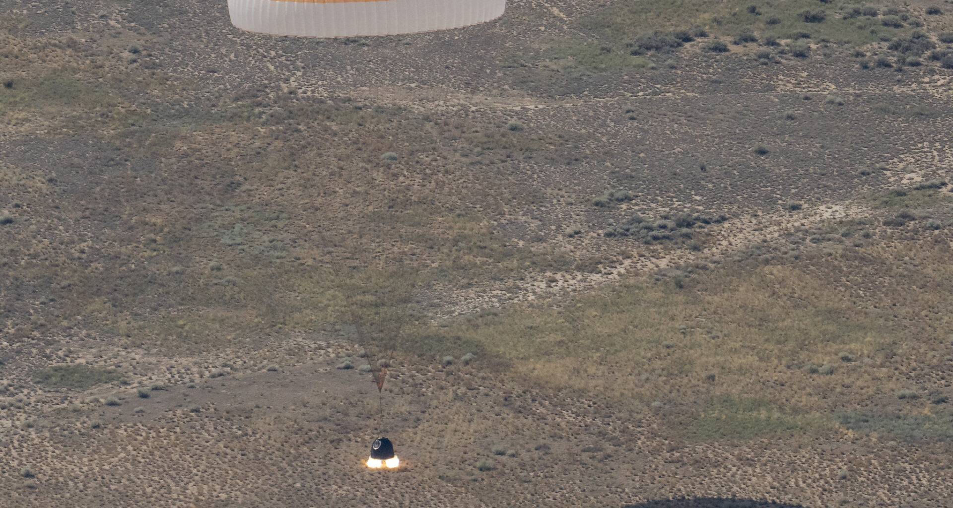 The Soyuz MS-28 spacecraft is seen as it lands in a remote area near the town of Zhezkazgan, Kazakhstan