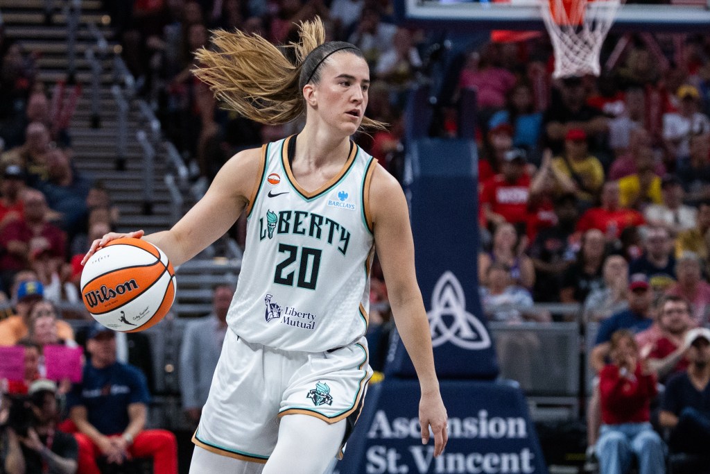 New York Liberty guard Sabrina Ionescu (20) dribbles the ball.