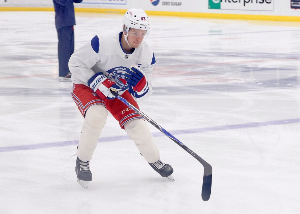 Hockey player Alberts Smits (63) in New York Rangers gear on the ice during development camp.