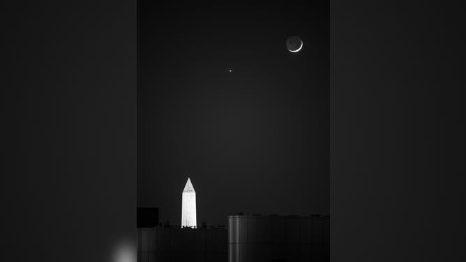 The Moon and Venus, center, are seen in conjunction above the Washington Monument, Monday, May 18, 2026, as viewed from the Mary W. Jackson NASA Headquarters Building in Washington.