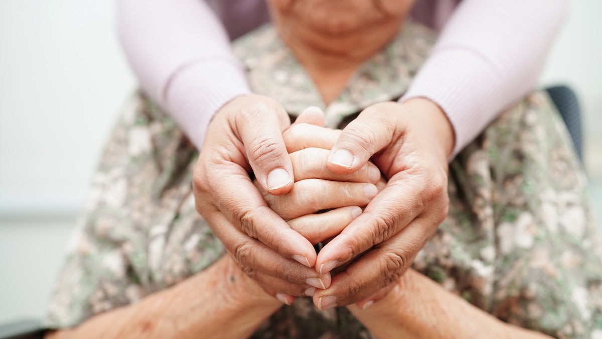 Older lady with caregiver