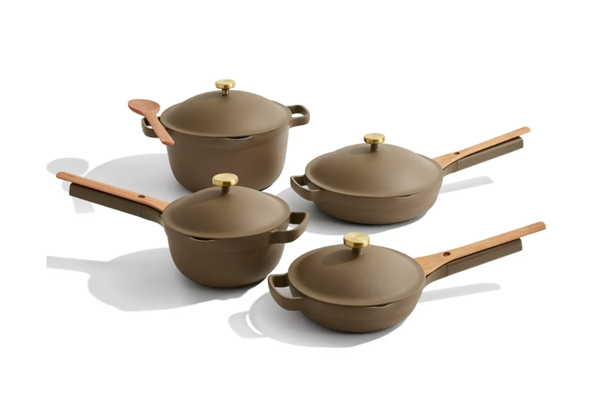 Four brown pots and pans with lids, featuring wooden handles and gold knobs.