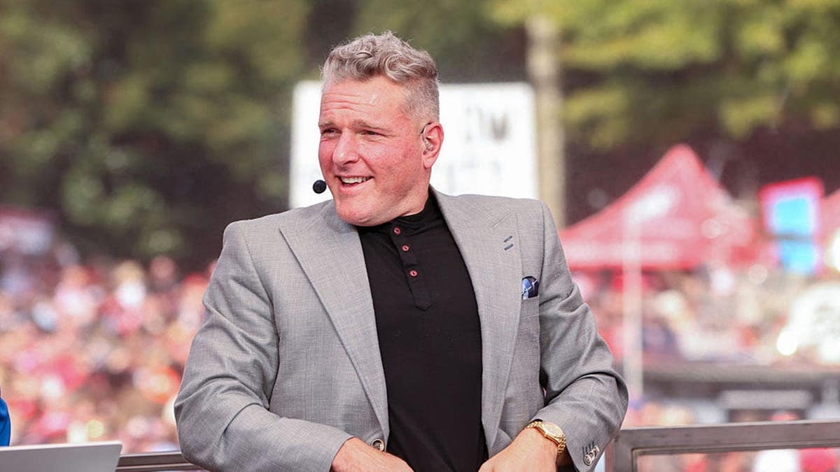 Pat McAfee smiling at Sanford Stadium in Athens, Georgia
