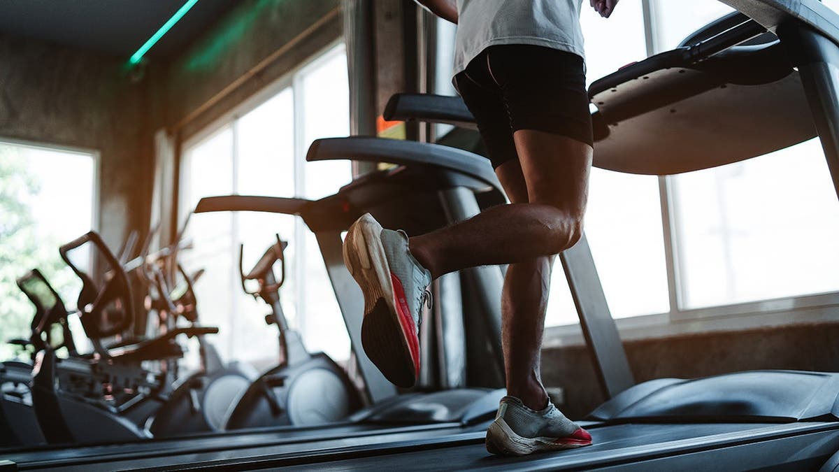 A man runs on a treadmill.