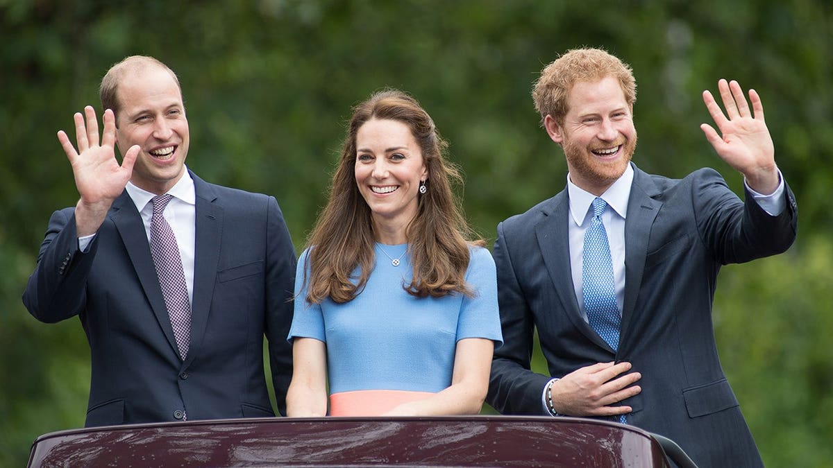 Prince William, Duchess of Cambridge Catherine, and Prince Harry standing together outdoors.
