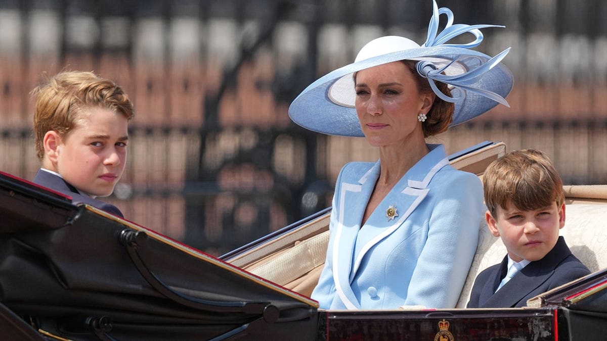 Kate Princess of Wales with sons Prince George and Prince Louis in open top carriage
