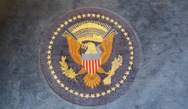 The great seal of the united states on a rug.