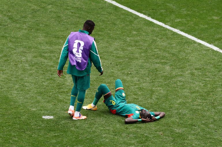 Soccer Football - FIFA World Cup 2026 - Round of 32 - Belgium v Senegal - Seattle Stadium, Seattle, Washington, U.S. - July 1, 2026 Senegal's Pathe Ciss looks dejected after the match as Senegal are eliminated from the World Cup REUTERS/Lee Smith