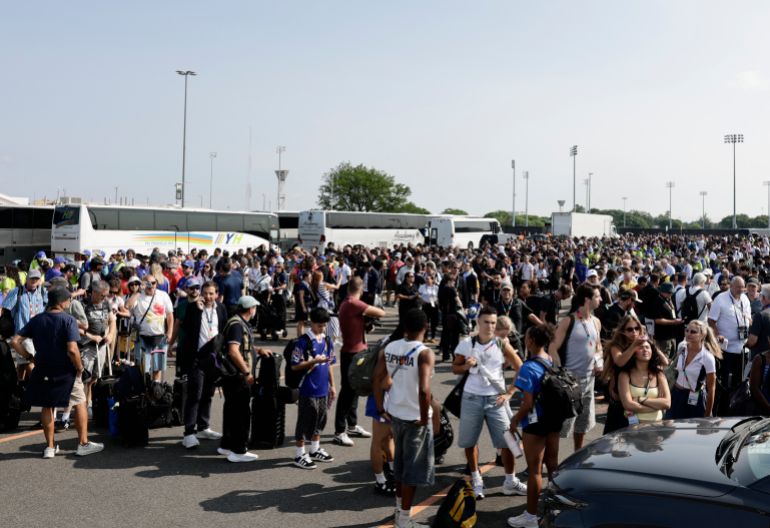 Soccer Football - FIFA World Cup 2026 - Final - Spain v Argentina - New York/New Jersey Stadium, East Rutherford, New Jersey, U.S. - July 19, 2026 Members of the media and staff queue outside the stadium before the match REUTERS/Jeenah Moon