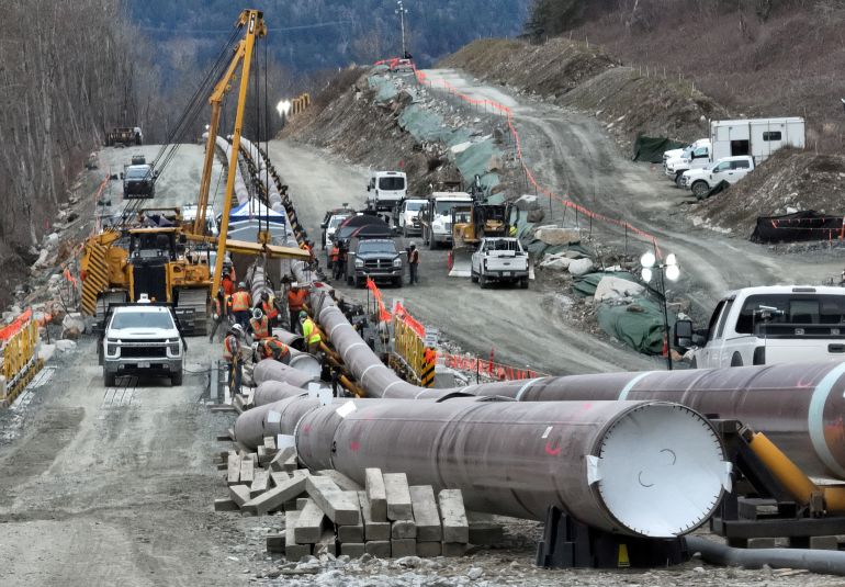 FILE PHOTO: The last section of pipeline is assembled on the Trans Mountain pipeline expansion project before operations are expected to begin in the second quarter of 2024, near Laidlaw, British Columbia, Canada, February 18, 2024. REUTERS/Chris Helgren/File Photo