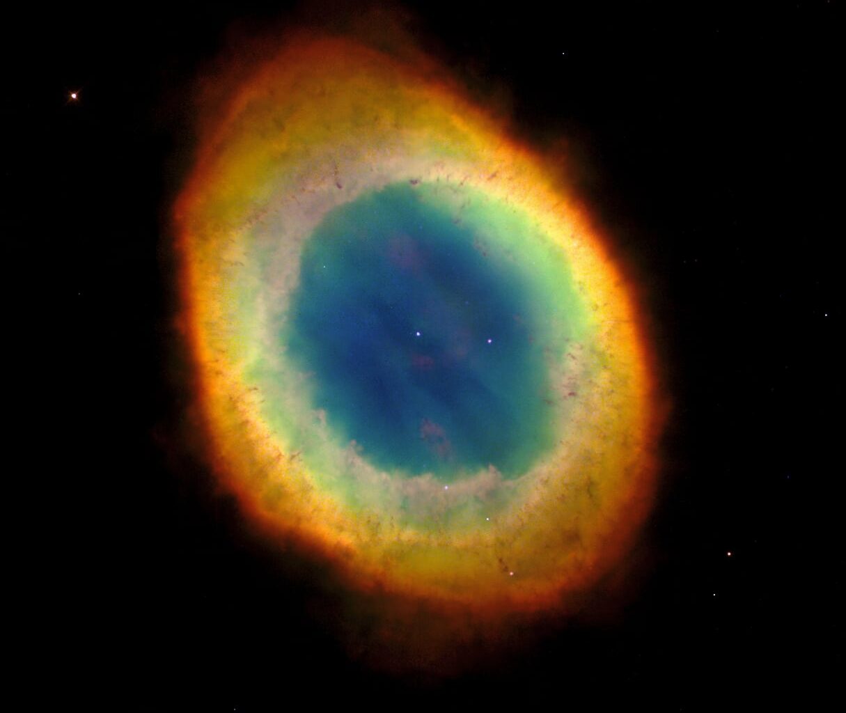 The Ring Nebula, another dying star's cast-off shell, lit from within by the hot white dwarf now forming at its center. Credit: NASA/ESA / Wikimedia Commons (public domain).