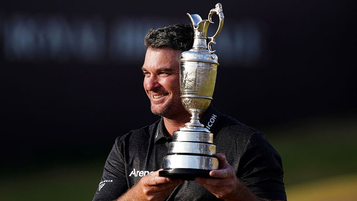 Ryan Fox of New Zealand celebrates with the Claret Jug after winning The 154th Open Championship