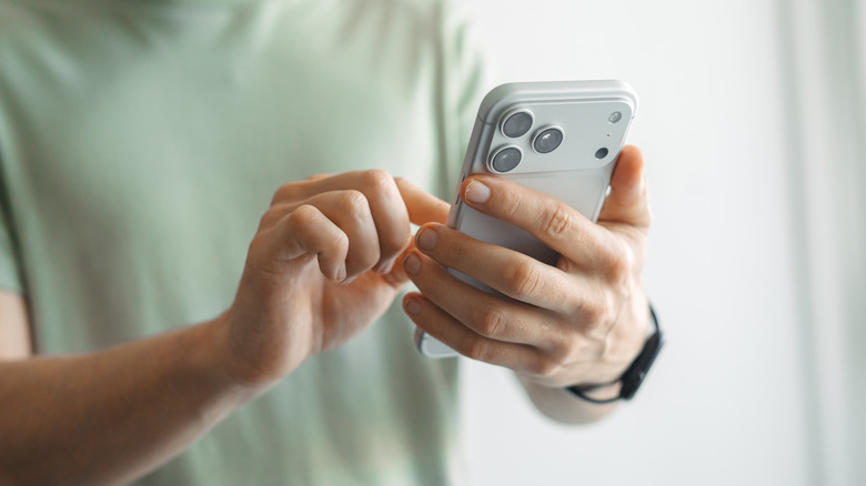 A man using an iPhone 17 Pro Max