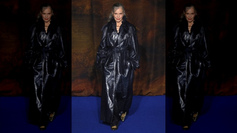 Elizabeth McGovern in a black trench coat at the Burberry fashion show in 2025