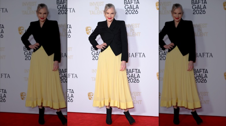 Elizabeth McGovern in a yellow skirt and black blazer at the BAFTAs