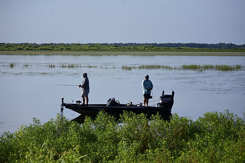 People fishing from a fishing boat on Lake Tohopekaliga
