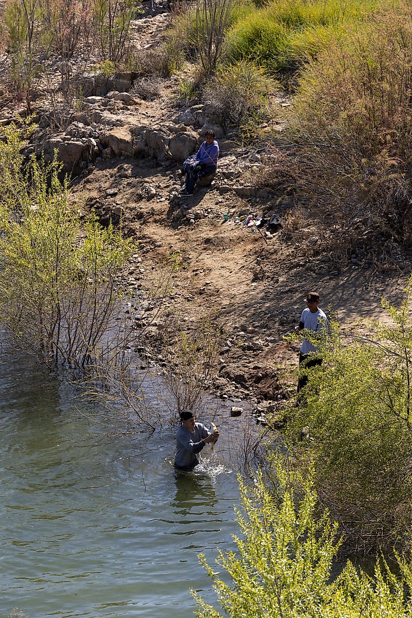 People fish around the shore of Diamond Valley Lake