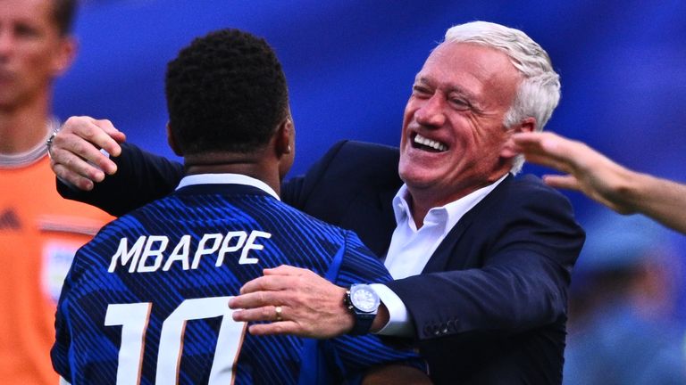 Kylian Mbappe celebrated with manager Didier Deschamps as the France boss returned to the dugout on Tuesday