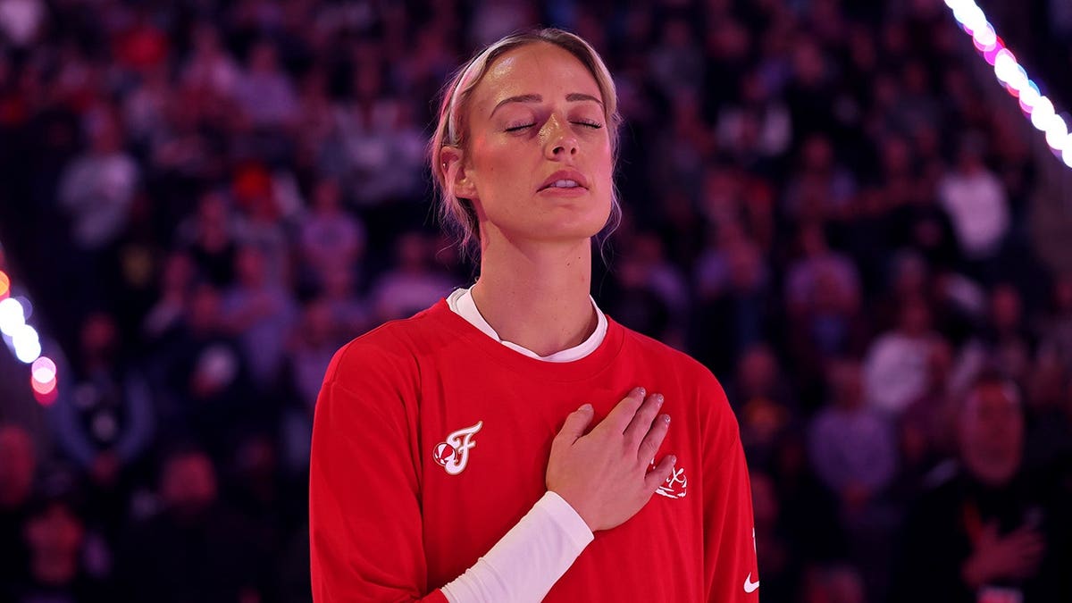 Sophie Cunningham of the Indiana Fever standing for the national anthem at Chase Center