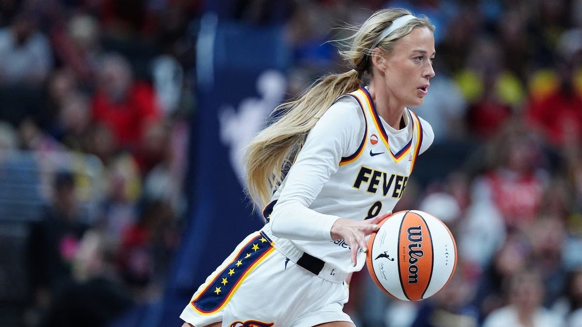 Sophie Cunningham brings the ball up court against the Connecticut Sun.