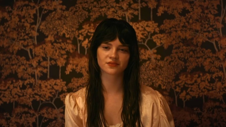 Elle has a mona lisa smile in Her Private Hell