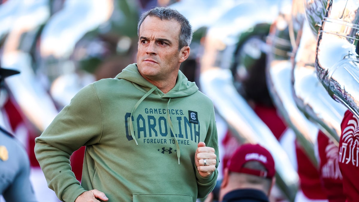 Shane Beamer takes the field