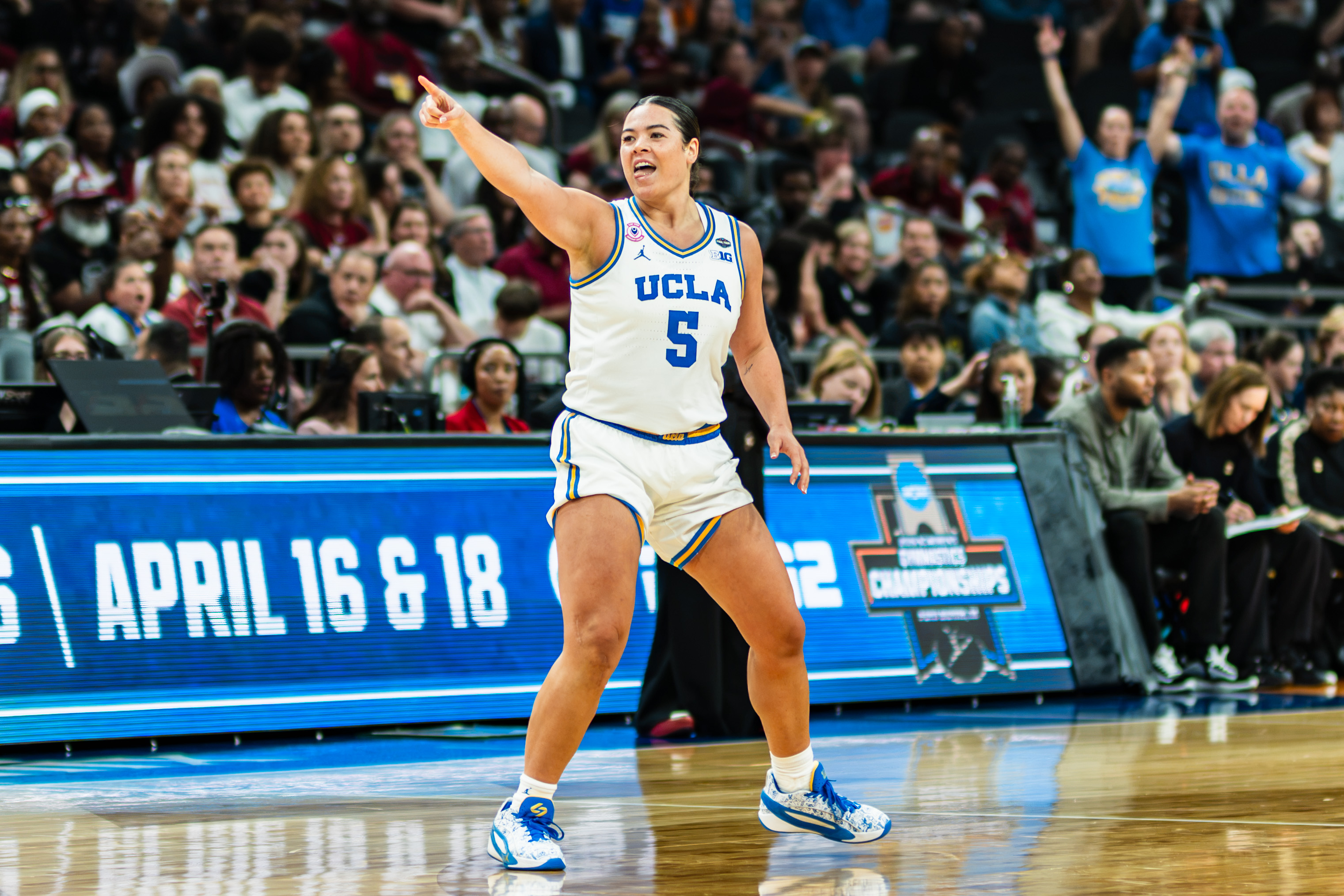 Former Bruin guard Charlisse Leger-Walker points down the court. Leger-Walker plays for the Connecticut Sun after being selected by them in the second round of the 2026 WNBA Draft. 
(Daily Bruin file photo)